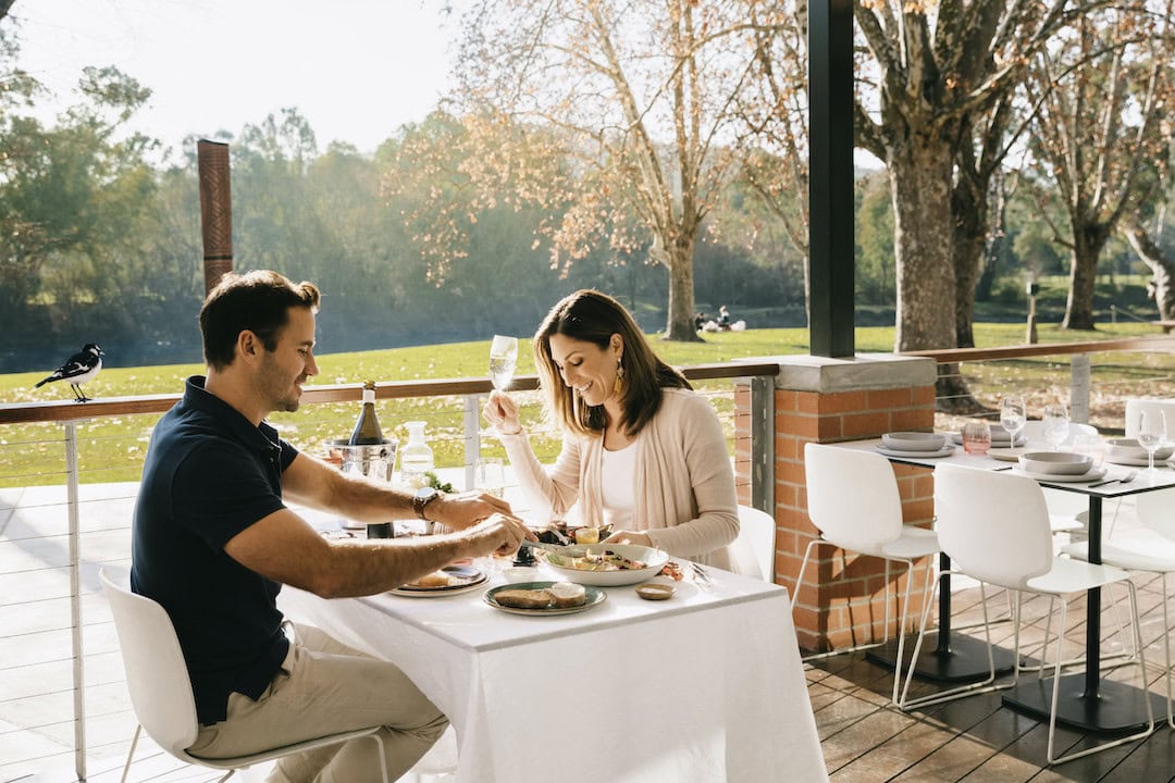 Couple enjoying a meal at River Deck Cafe, Albury.