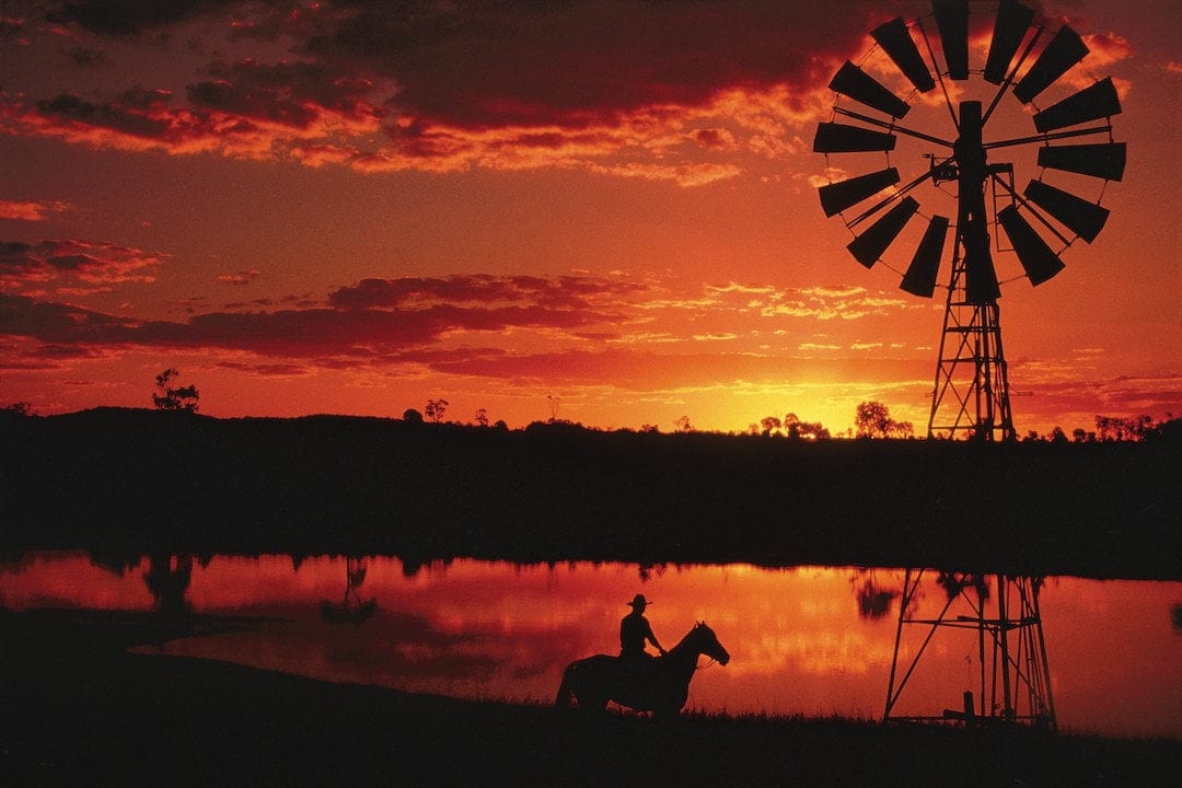 Outback sunset over waterhole