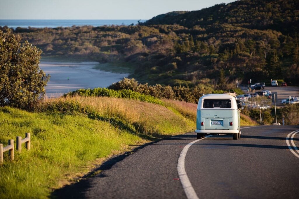 Kombi van driving along the coast