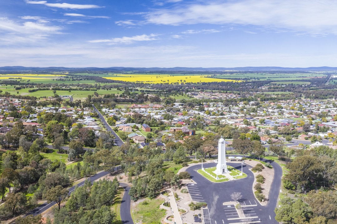 Aerial capturing the Parkes township with views across to the canola fields.