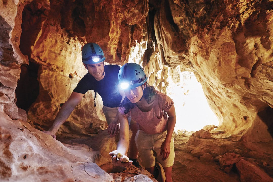 Couple exploring the Mimbi Caves with Girloorloo Tours. The Mimbi Caves are located 90 km's east of Fitzroy Crossing.