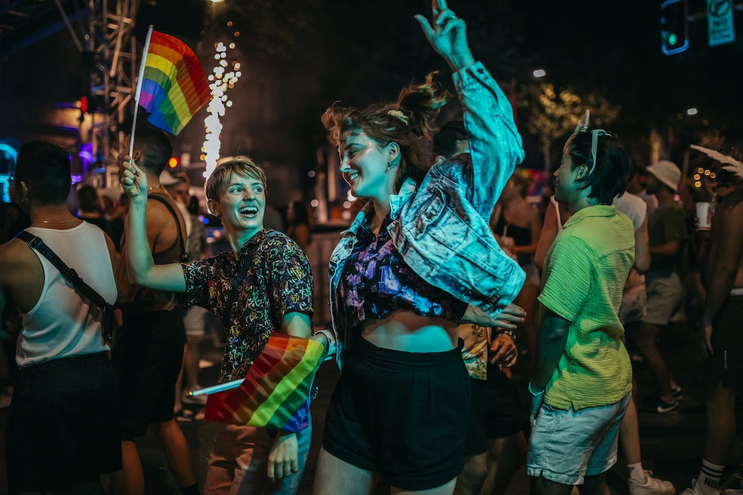 Couple dancing at the Oxford Street Party, a part of Sydney World Pride, a 17-day celebration of queer Australian people and culture, with more than 300 events across the city â including Sydney's famous Mardi Gras Parade.