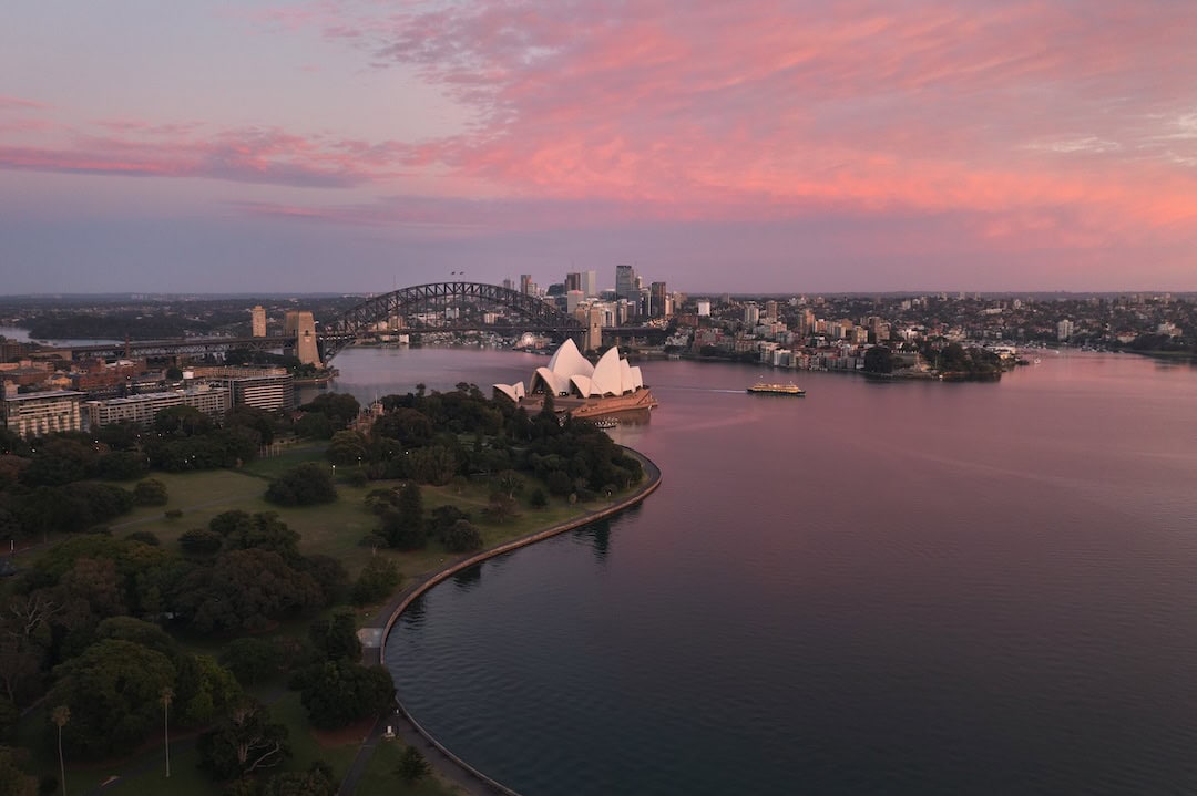 Scenic sunrise views over Sydney Harbour and the Royal Botanic Garden Sydney.